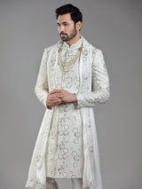 Royal splendor in cream silk with intricate embellishments and rich detailing