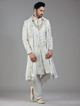 Royal splendor in cream silk with intricate embellishments and rich detailing