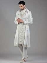 Royal splendor in cream silk with intricate embellishments and rich detailing