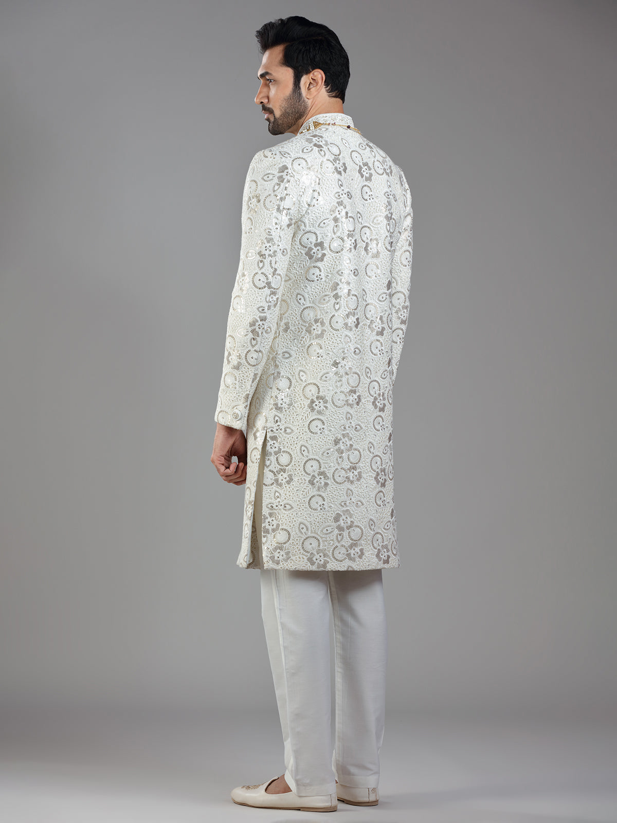 Royal splendor in cream silk with intricate embellishments and rich detailing