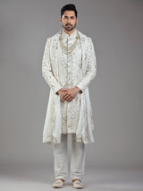 Royal splendor in cream silk with intricate embellishments and rich detailing