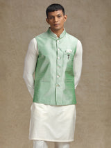 White and light green waistcoat set with intricate embroidery