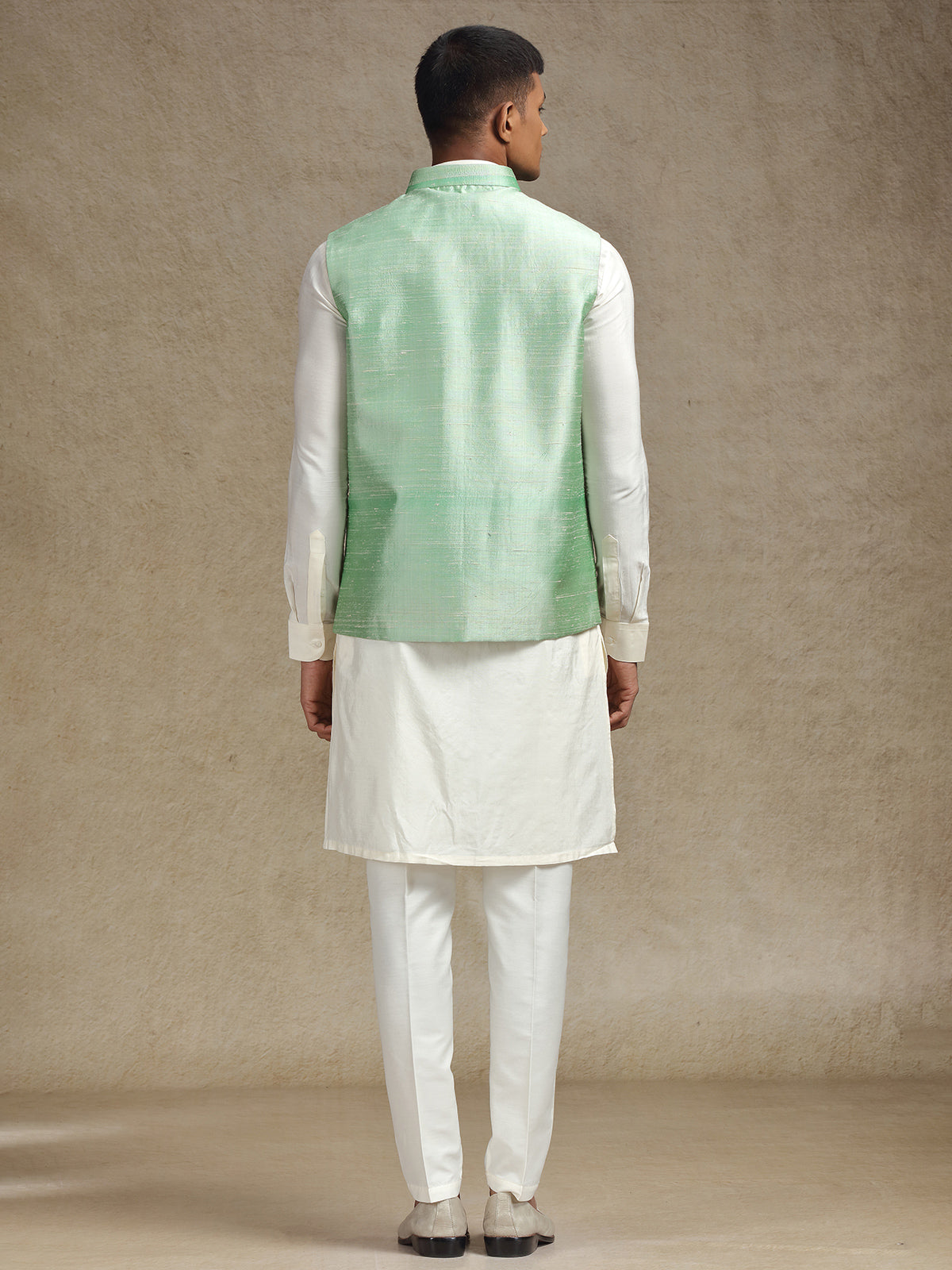 White and light green waistcoat set with intricate embroidery