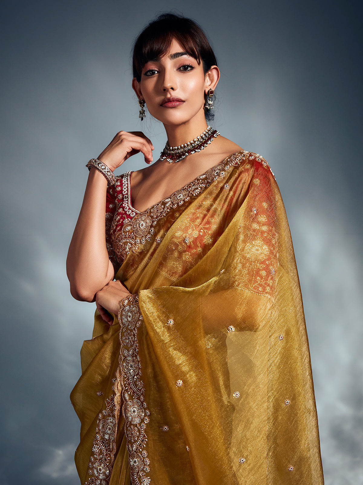 Yellow organza saree with sparkling accents